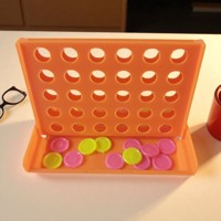 4 op een rij spel , oranje mini formaat 7,5cm x 4,5cm