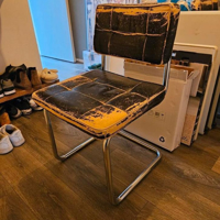 Vier eetkamerstoelen met leer