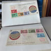 11 albums met 1 ste daguitgiftes van postzegels uit allerlei landen, voornamelijk van allerlei sporten