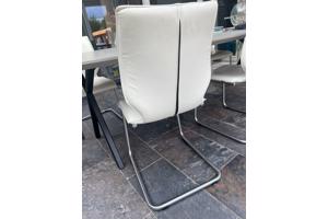 4 witte leren eetkamerstoelen