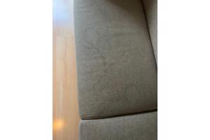 Bijenkorf bank beige stof zilveren poten