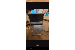 Vier eetkamerstoelen met leer