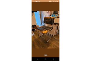 Vier eetkamerstoelen met leer