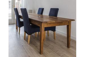 Lange houten eettafel + 4 stoelen