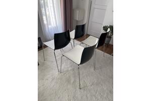 Vier design eetkamerstoelen zwart-wit
