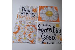 Set van 4 kussenhoezen bloem en tekst wit oranje geel 40x40c