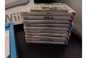 Nintendo Wii console + 2 controllers + 1 nunchuk + 11 games