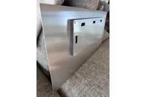 Two black and white photographs printed on metal