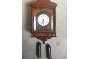 slinger klok met gewichten