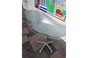 Glazen bureautje . Twee delen, draaibaar zijblad. RVS onderstel.