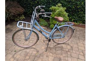 Sparta damesfiets met bagagedrager voorop