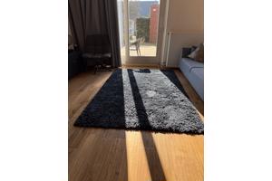 Groter donkerblauw groot vloerkleed