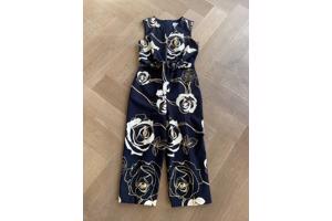 Blauwe jumpsuit met wit/gouden bloemen van Joseph Ribkoff