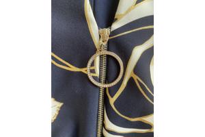 Blauwe jumpsuit met wit/gouden bloemen van Joseph Ribkoff