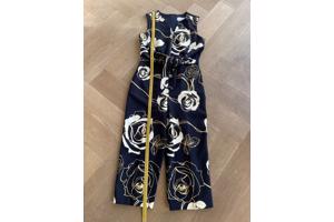 Blauwe jumpsuit met wit/gouden bloemen van Joseph Ribkoff