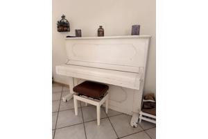 Mooie goed werkende witte piano