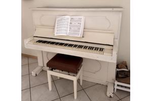 Mooie goed werkende witte piano