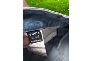 wijde jeans driekwart lang met omslagpijp lichtblauw 32 M/L
