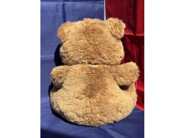 Beer met strik en rits voetzolen bruin beige