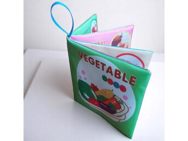 Educatief stoffen knisper babyboekje vegetable