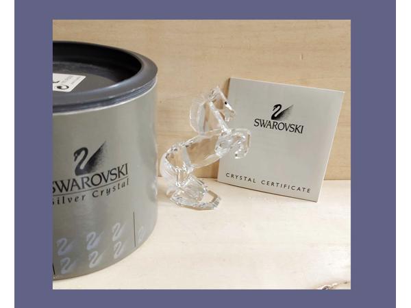 Swarovski hengst doos en certificaat oortjes gerepareerd