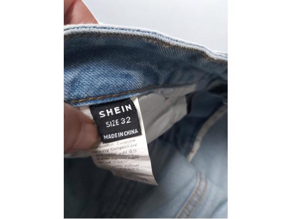 wijde jeans driekwart lang met omslagpijp lichtblauw 32 M/L