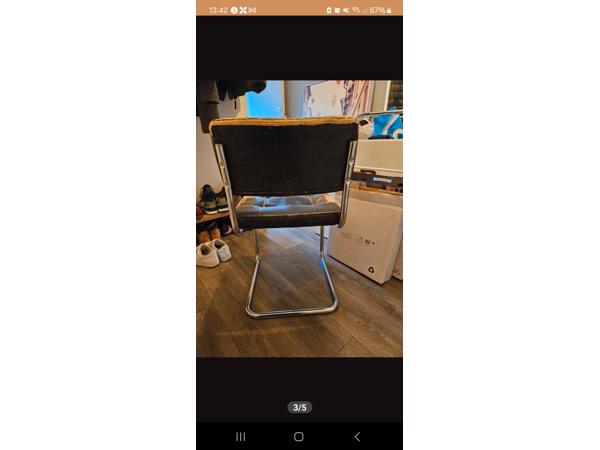 Vier eetkamerstoelen met leer