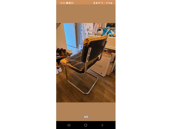 Vier eetkamerstoelen met leer