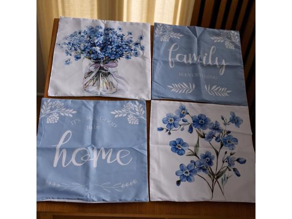 Set van 4 kussenhoezen lichtblauwe flowers met tekst 45x45cm
