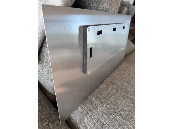 Two black and white photographs printed on metal