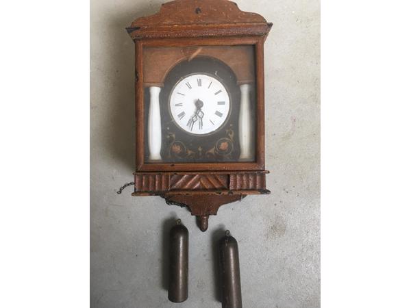 slinger klok met gewichten