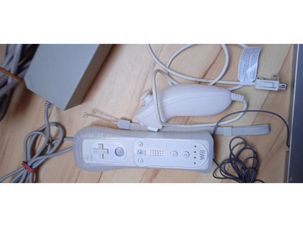 Nintendo Wii + 1 controller + 1 nunchuk