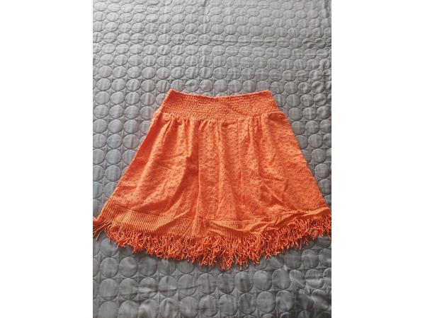 Drole de Copine rok gaatjes patroon oranje M/L 38/40