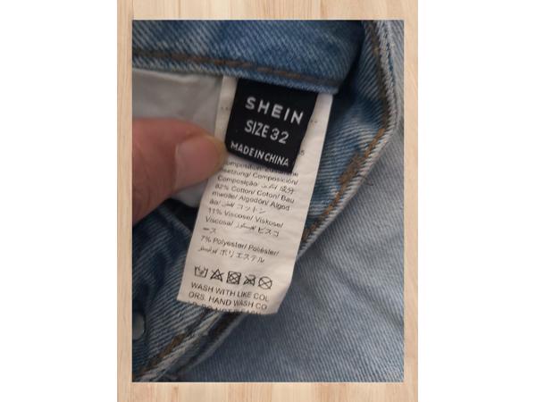 wijde jeans driekwart lang met omslagpijp lichtblauw 32 M/L