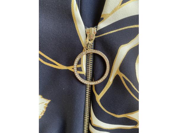 Blauwe jumpsuit met wit/gouden bloemen van Joseph Ribkoff