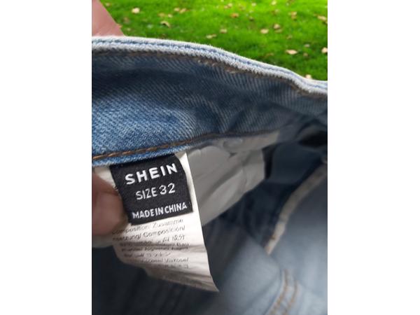 wijde jeans driekwart lang met omslagpijp lichtblauw 32 M/L